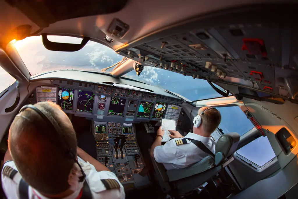aircraft pilots in cockpit looking out of window